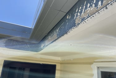 Peeling exterior paint under eaves before house repainting in Brisbane