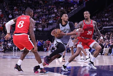 Stephon Castle of the Spurs controls the ball against Kris Dunn and John Collins of the Clippers