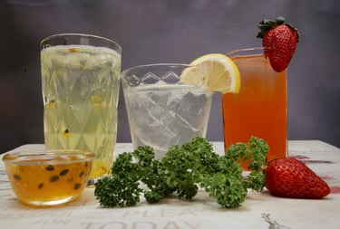a variety of cocktail drinks on a table