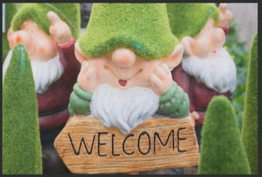 a group of gnomes sitting on top of a wooden sign