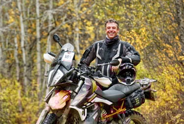 a man in a black jacket and a motorcycle