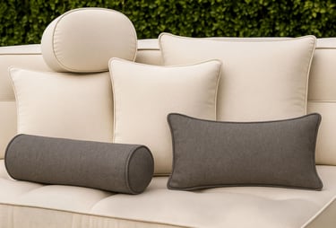 Solo Home Decor’s custom outdoor cushion collection featuring beige and charcoal pillows in various shapes 
