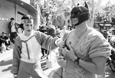 Man in Batman mask in Shanghai showing off his ladybird tattoo