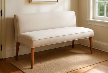 Neutral upholstered bench settee in a Los Angeles entryway with soft light, warm wood flooring, and layered woven textures.