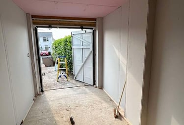 Plasterboard installation on a living room ceiling by Franklins Plastering in Worcester.