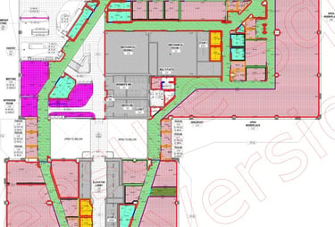 Technical architectural floor plan illustrating a modern office layout with color-coded workspaces.