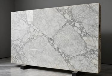 Massive Calacatta marble slab standing upright in a minimalist luxury showroom, soft diffused studio light, high-contrast veining.