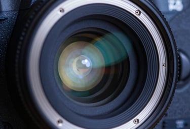 A close-up of a high-resolution professional camera sensor. The lighting is precise, highlighting the technical sophistication in dark blue and pearl white.