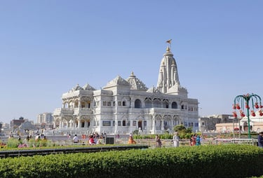 a large white building with a clock tower