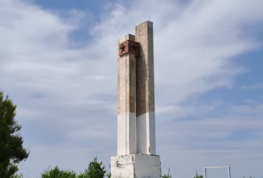 a tower monument with a star on top of it