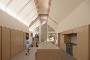 Modern minimalist kitchen with vaulted ceilings, large skylights, and a central wooden island.