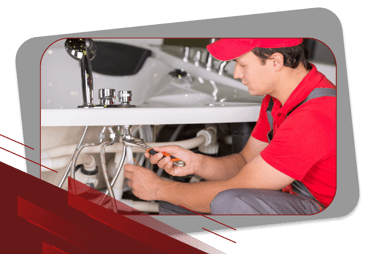 a plumber in a red shirt and a red hat