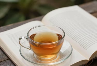 A close-up of a cup of tea next to an open book in a quiet garden in Indonesia. The environment is serene and perfect for reading. Soft natural light.