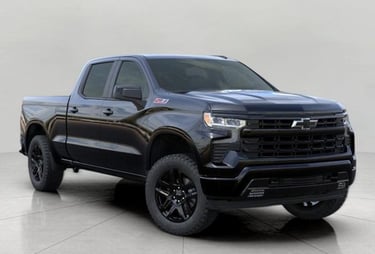 a black chevrolet silveradoo truck with a black and white background