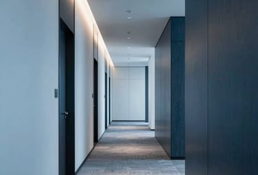 A modern, sophisticated office hallway in North America, with light blue and dark blue textures and professional lighting.