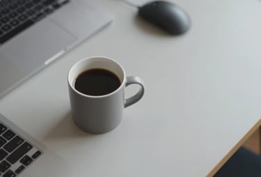 A top-down view of a designer's workspace featuring a coffee cup and high-end tech accessories on a light gray #E0E1DD desk. The style is inviting and modern.