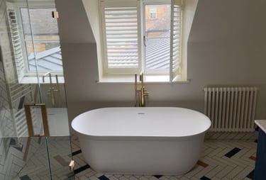a bathtub with a large tub in the middle of a bathroom in pershore 