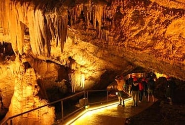 Illuminated view of tourists visiting Lipa Cave near Cetinje Montenegro 