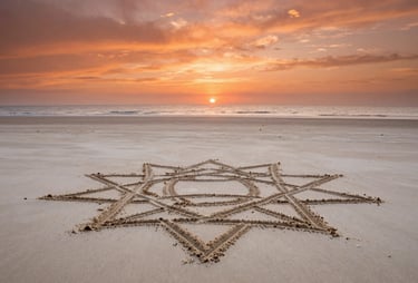 Cinematic wide shot of a tranquil beach at sunset, warm terracotta orange hues in the sky, a large intricate geometric sand drawing in the foreground on soft sand off-white.