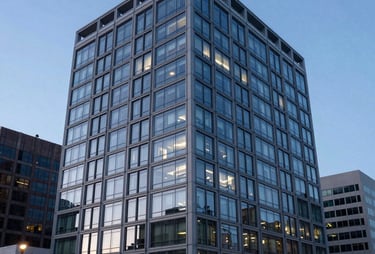 A professional landscape photo of a modern corporate building in a North American US tech district during twilight, blue-toned windows.