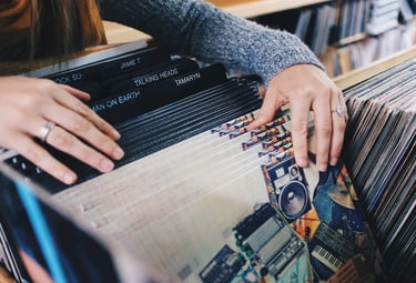 Someone browsing through vinyl records