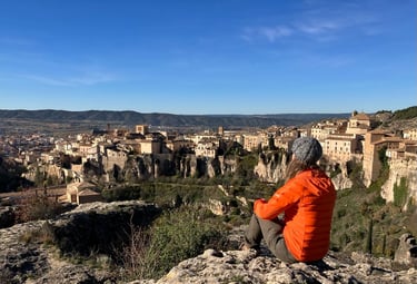 inspirella sitting on the rocks, overlooking Cuenca in Spain