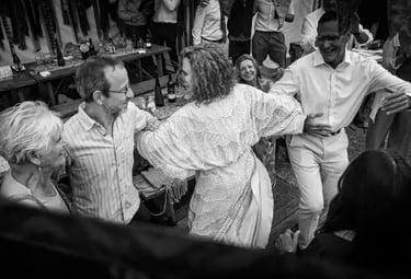 Wedding guests enjoying a fast-paced barn dance led by Rowans, a premier Irish folk and ceilidh band in Devon