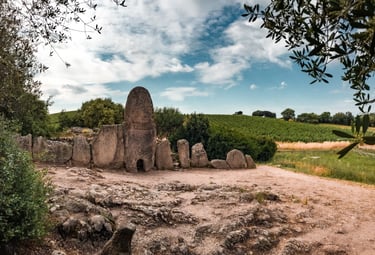 Giants’ Tomb Coddu Vecchiu in Arzachena with Capichera vineyards, Sardinia