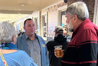 a group of people standing around a table