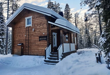 Rustic finnish log cabin in a snowy winter landscape, riekontupa cabin located in Kittilä lapland