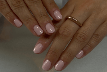 a woman's hands with two rings on them