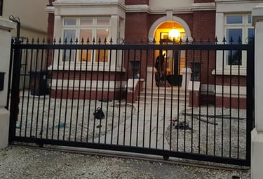 a large house with a gated in area with a gate