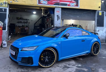 Expertly painted blue car with custom wheels at MKMotors garage in NW2