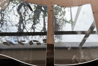two mirrors with a window in the middle