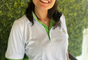 a woman in a white shirt and glasses
