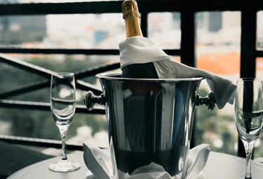 Chilled champagne bucket with two glasses; Photo by Albert Vincent Wu on Unsplash