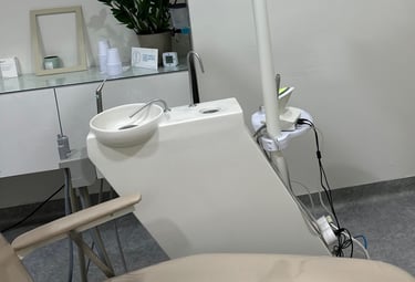 a dental room with a chair and a chair