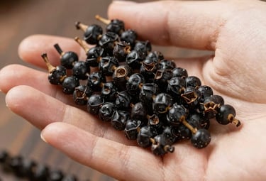 A customer happily unpacking a Sattvik Spices delivery box at home.