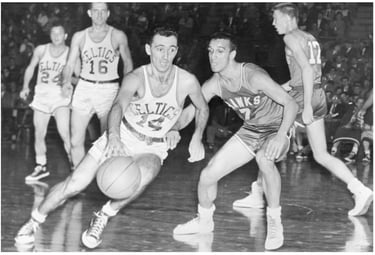 Photograph of Bob Cousy with the Boston Celtics playing the Milwaukie Hawks in 1954