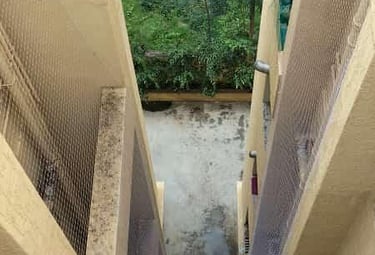 Close-up of a safety net being inspected for quality and durability.