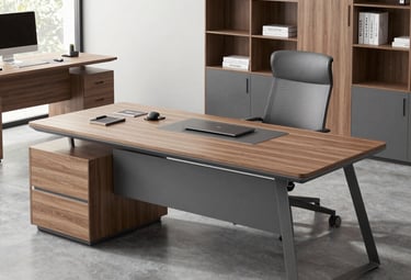 Modern office workspace with a team collaborating around a laptop.