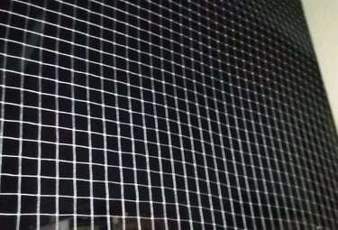 Close-up of premium balcony netting material stretched tightly for safety.