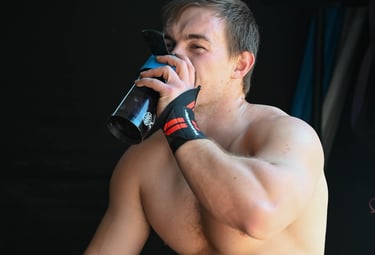 Athlete drinking his intra-workout shake during training