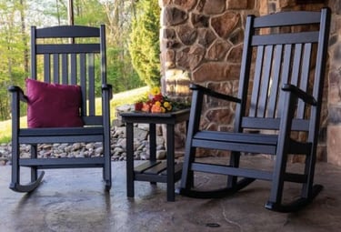 High-quality rocking chairs with matching table on front porch