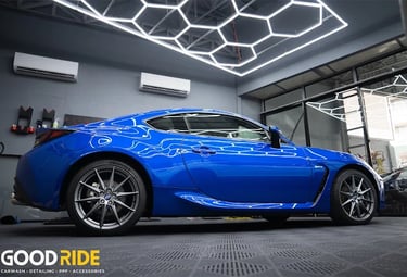 a blue car with a blue flame painted on it
