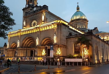 a church with a clock tower in the middle of a street