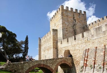 a castle like structure with a bridge over a river