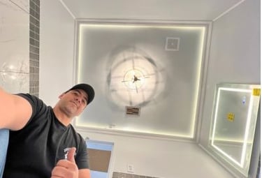 A uniformed Josue David Home Solution technician performing handyman services in Chattanooga, TN.