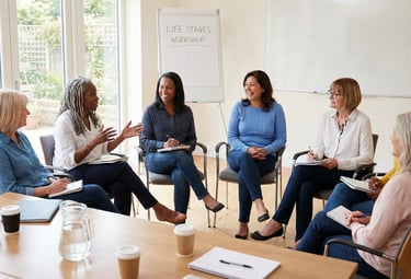 multigenerational, multi-ethnic group of women sitting in a semi-circle