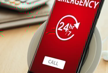 a phone with a red emergency call sign on it